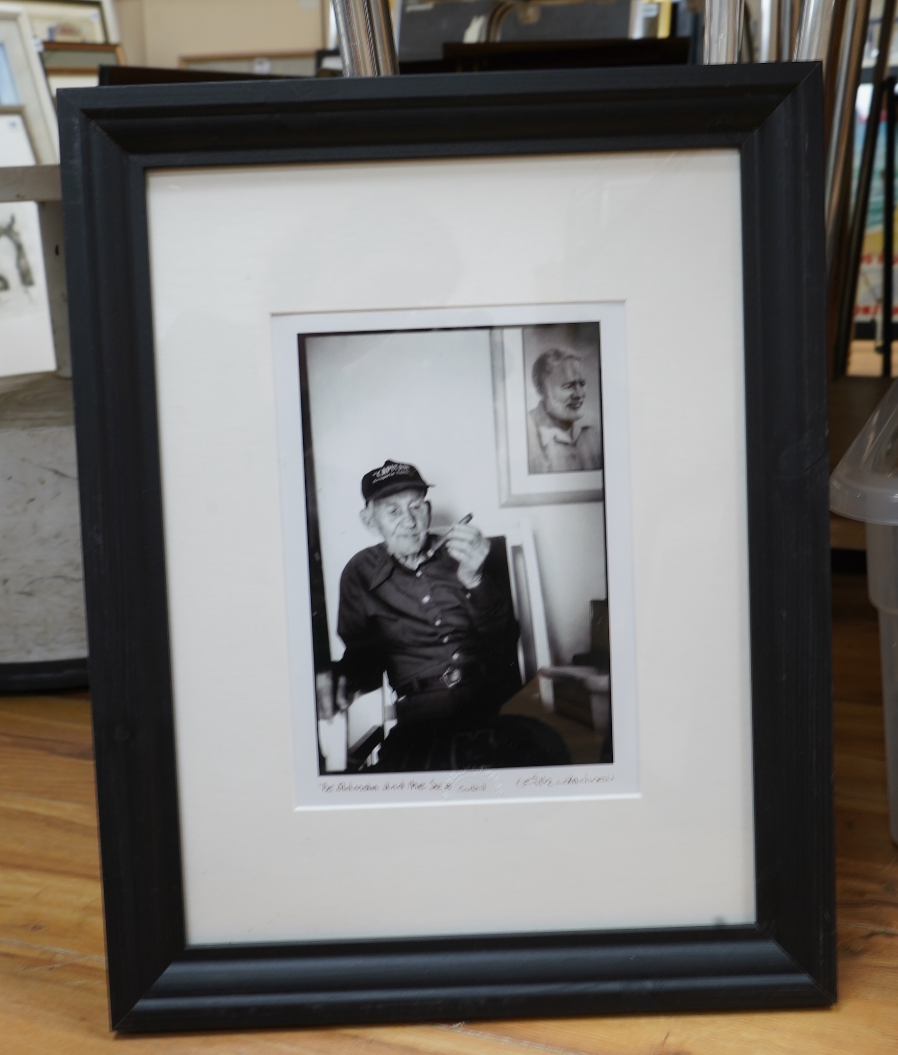 Keith Cardwell (Contemporary), Three gelatin silver prints to include ‘Old Man and the Sea, Cuba’, stamped, signed and titled in ink to the margin and ‘Korda with his Che’, stamped, largest 25 x 17cm, together with a boo